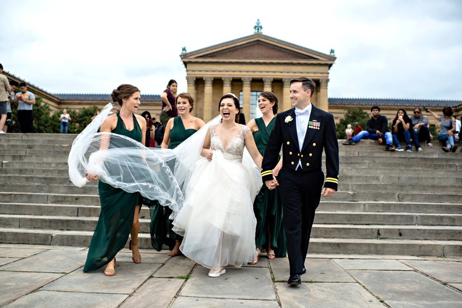 A wedding party walking down the Philadelphia Art Museum steps.